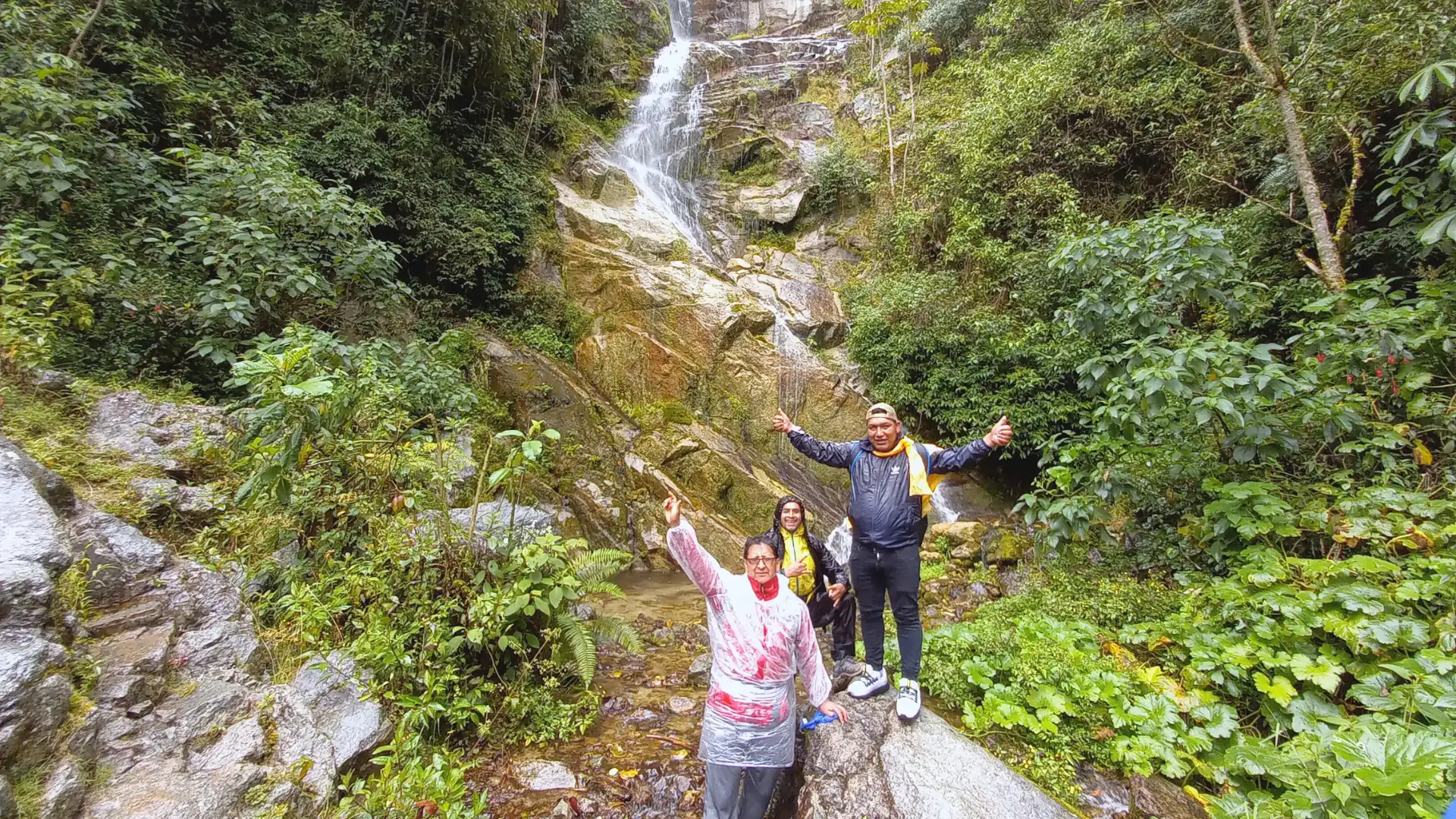 Hikers at a waterfall on the Inca Trail.