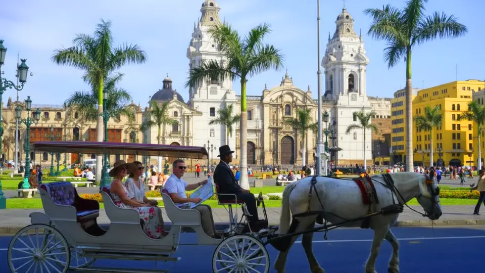 Tourists enjoying a carriage ride through Lima’s Plaza de Armas
