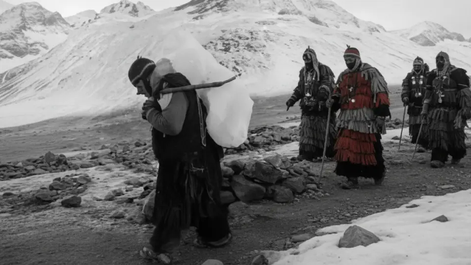 Ukukus descending the mountain at dawn carrying a block of ice